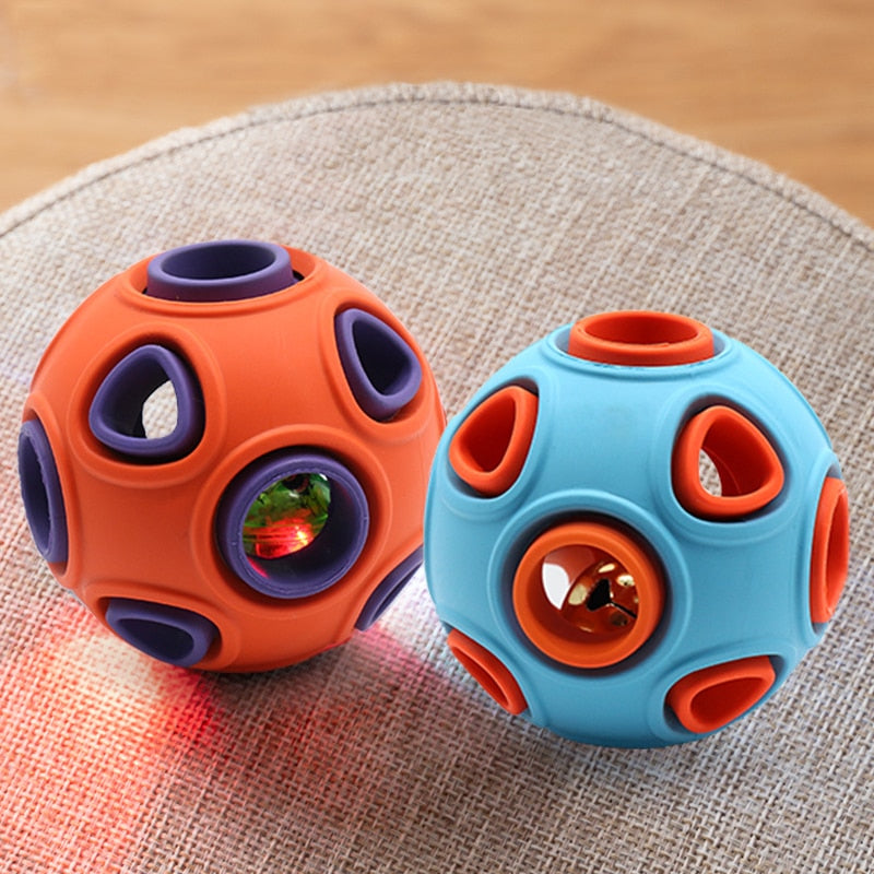 Interactive dog chew ball that dispenses treats and fun