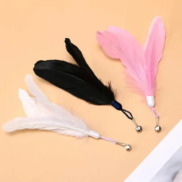 Interactive cat teaser toy with feathers, bell, and suction cup