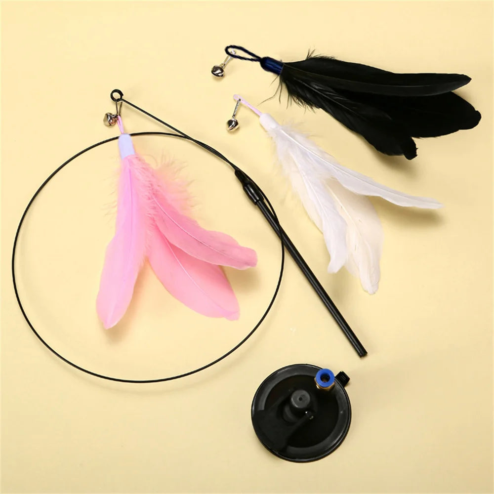 Interactive cat teaser toy with feathers, bell, and suction cup